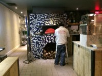 Capofitto's oak-burning pizza oven.